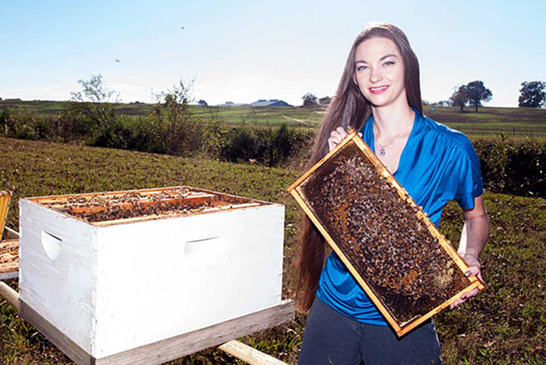 Heather Blackwell with bee hive