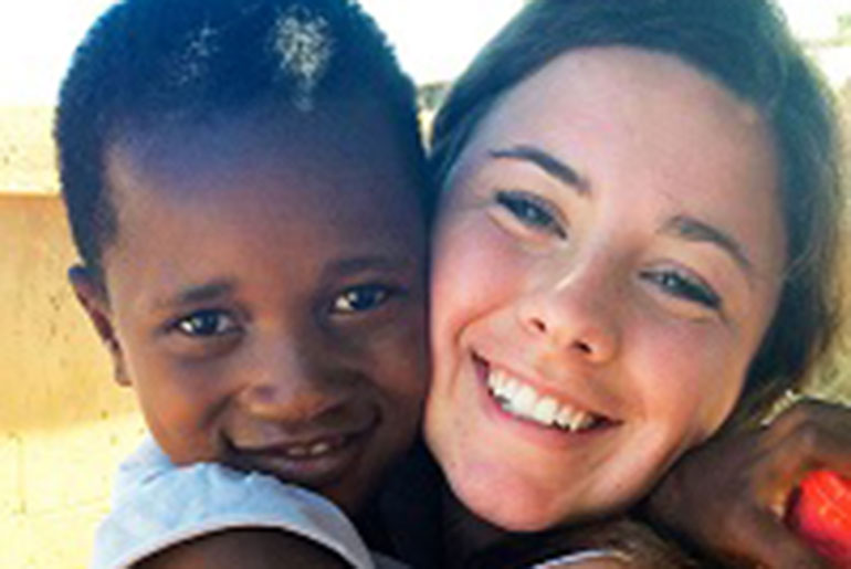 Shelbie Dalton with South African child